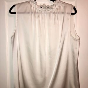 Brand new! Sheer white, sleeveless Blouse. Large